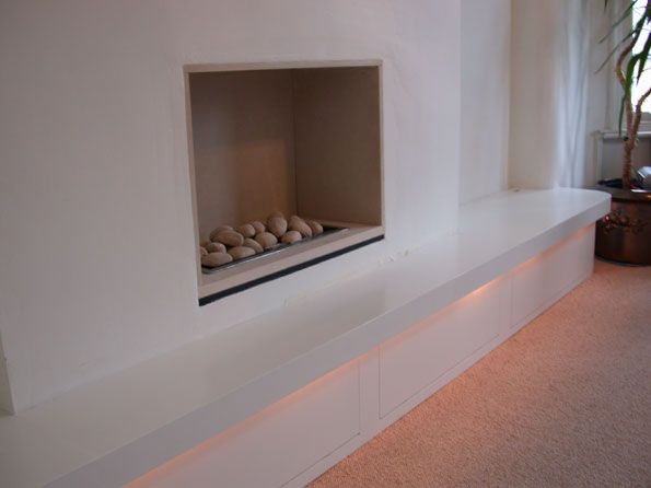 The full unit and fireplace with the lights on