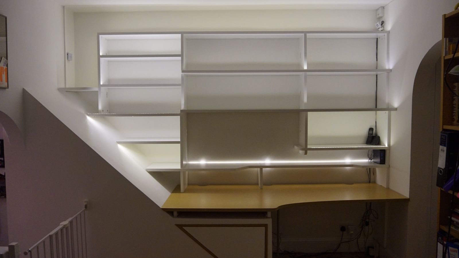 The finished shelving and desk, lit and empty