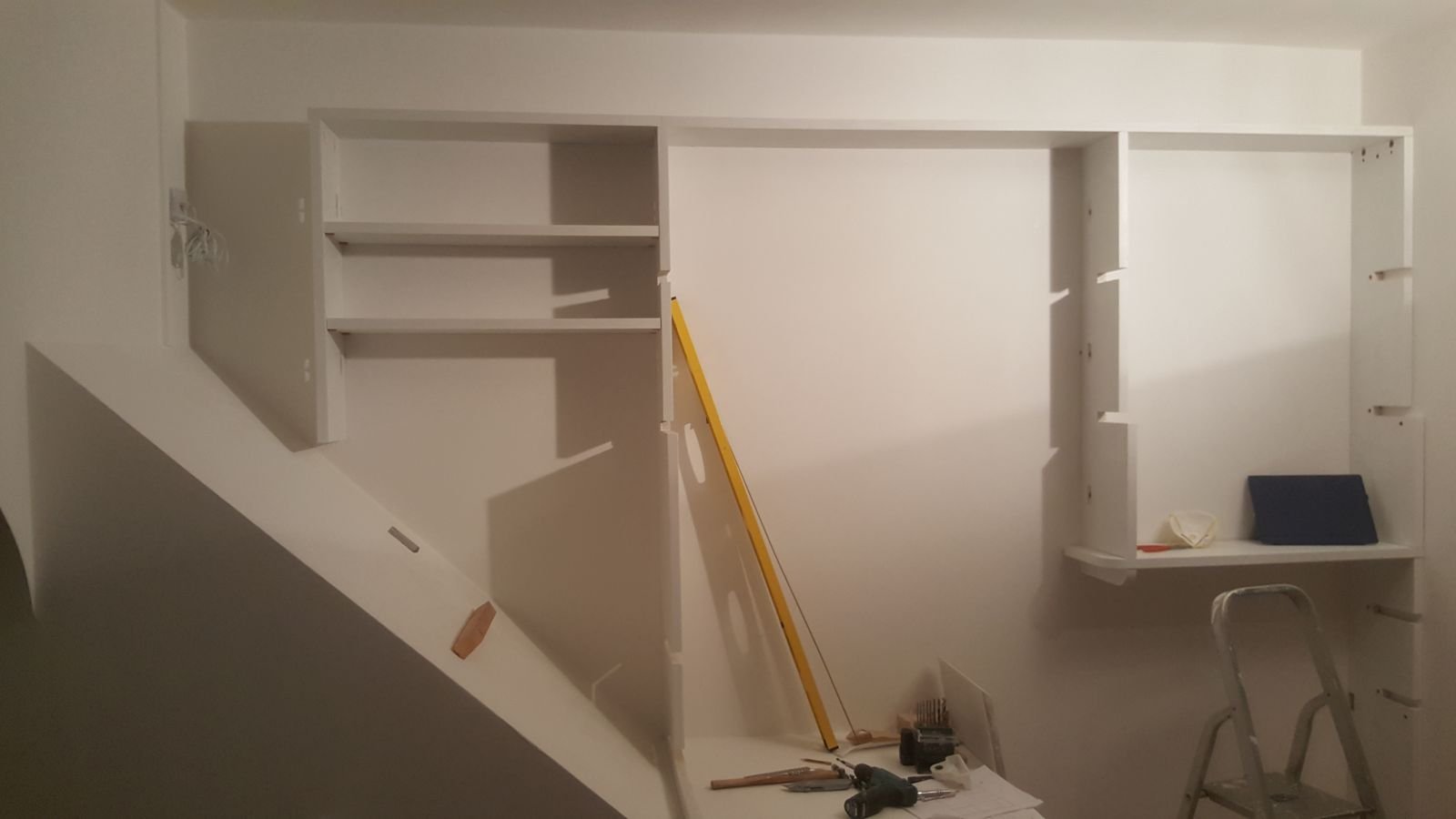 The first shelves slotted into the posts
