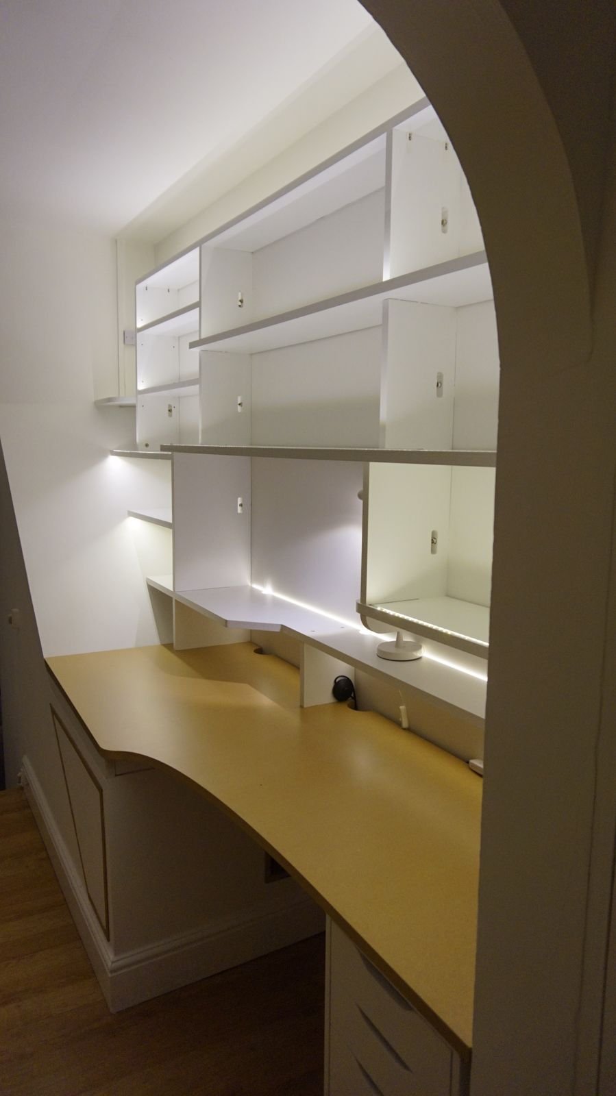 The curved desk seen through an arched doorway