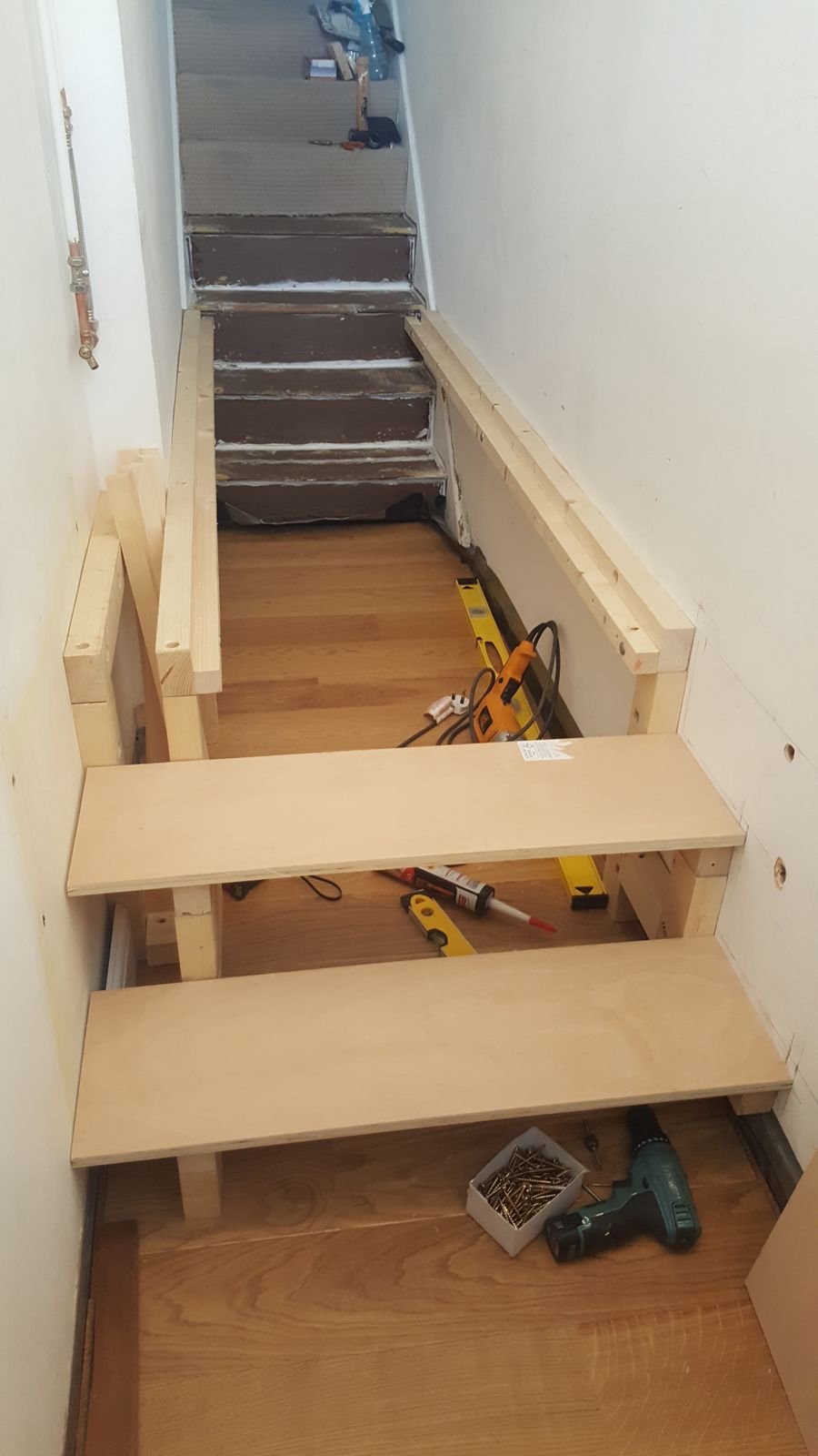 The softwood frame going in along the hallway